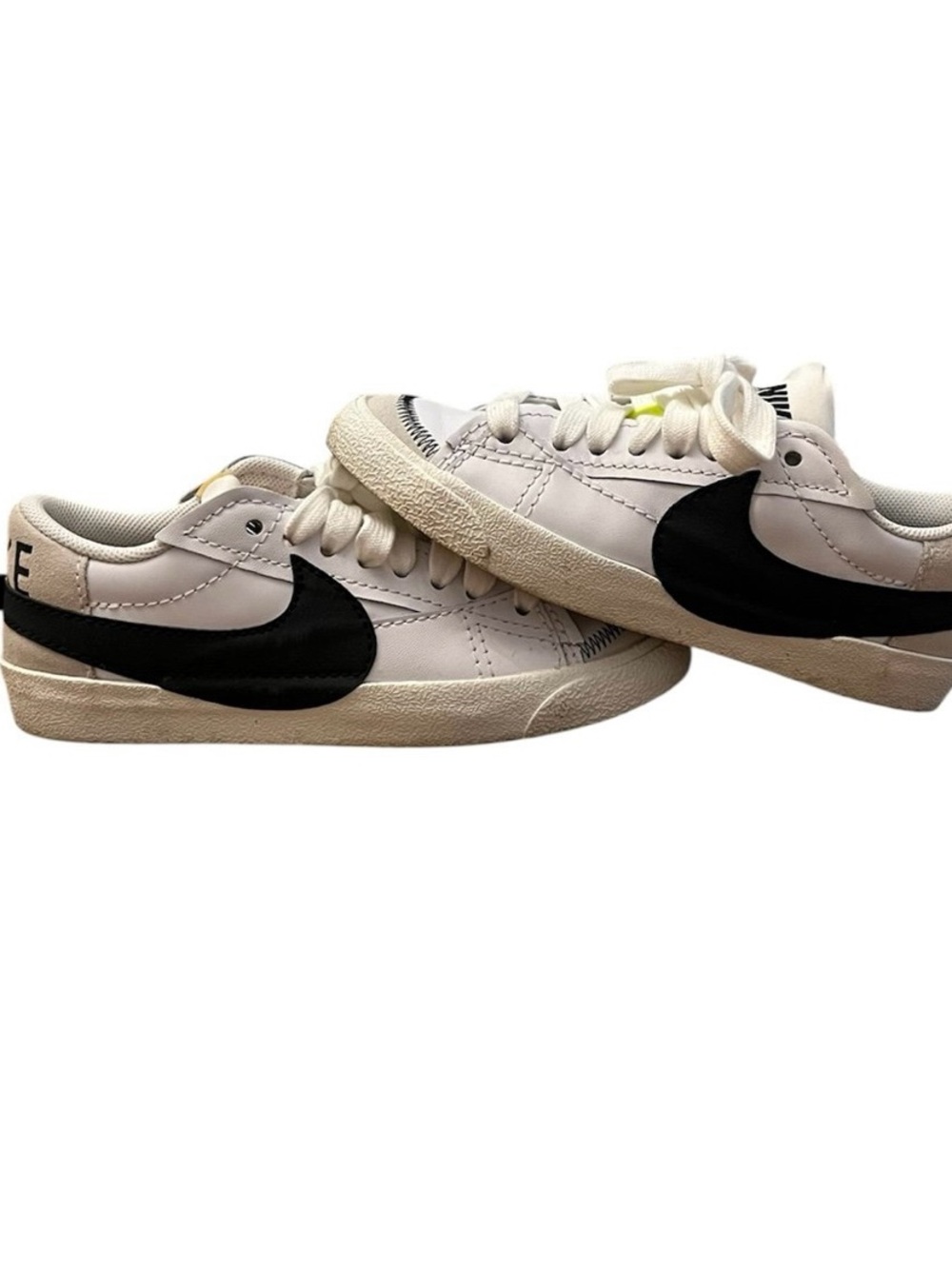 Nike White Low-Top Sneakers with Black Swoosh